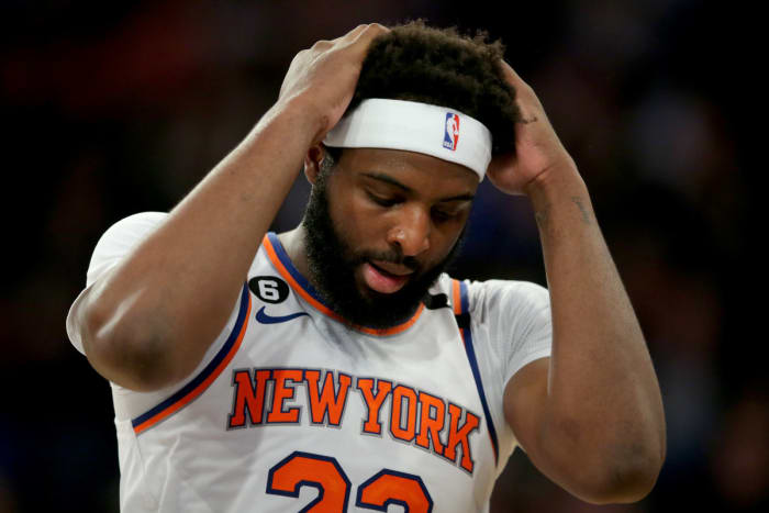 Knicks center Mitchell Robinson puts his hands on his head during Game 1 against Heat